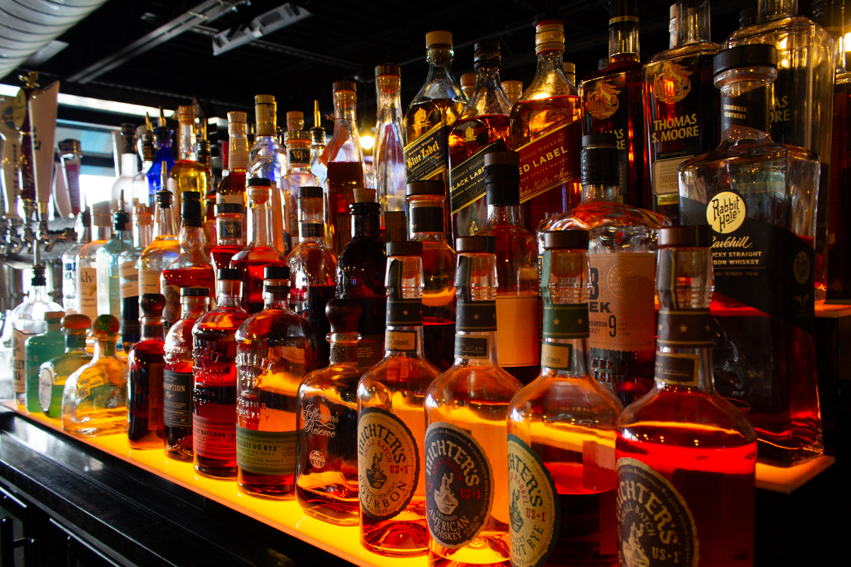 Interior_20220830 - 006comp Example of Food Photography for DoorDash, Uber Eats, Grub Hub, and any food delivery service app. Food Photo is of an alchol shelf in a bar portion of a restaraunt, showcasing the wide varity of beverages avaialable.