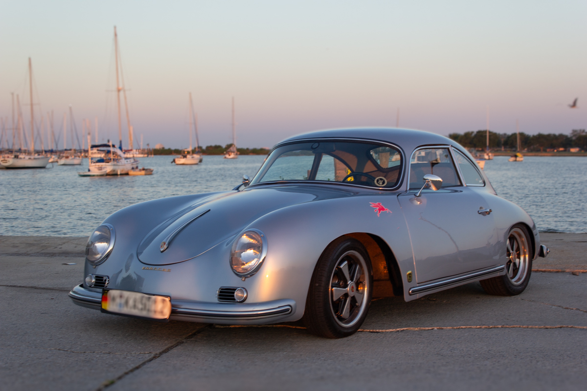 Porsche_2023062023 (1)comp Example of Automotive Photography. Car Photography and Videography for Bring-a-Trailer, Auto Hunter, Barn Finder, Auto Trader, and any car and automobile sales sites. Car Photo is of a light blue Porsche from the driver's front of the vehicle. The background is on a bay inlet and features boats in the background parked in their marina's