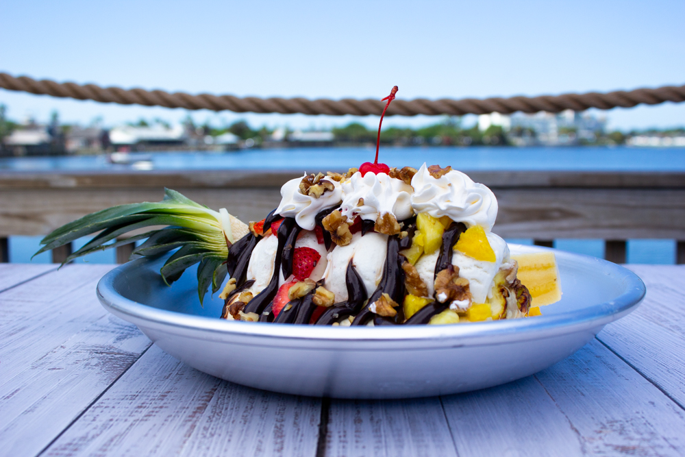 Banana_Split_20220412 - 002 Example of Food Photgraphy for DoorDash, Uber Eats, Grub Hub, and any food delivery service app. Food photos can be also be used on websites, or for in-house print menu. Food Photo shows a Banana Split outdoors showcasing outdoor photography.