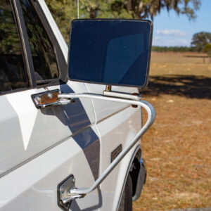 Example of Automotive Photography. Car Photography and Videography for Bring-a-Trailer, Auto Hunter, Barn Finder, Auto Trader, and any car and automobile sales sites. Car Photo is of the passenger's side mirror of a white Ford F-250