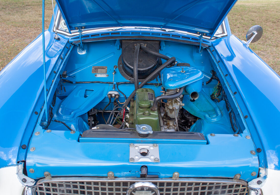 1956_Nash_Metropolitan_20230210 (101)comp Example of Automotive Photography. Car Photography and Videography for Bring-a-Trailer, Auto Hunter, Barn Finder, Auto Trader, and any car and automobile sales sites. Car Photo is of the engine compartment of a blue and white 1956 Nash Metropolitan.