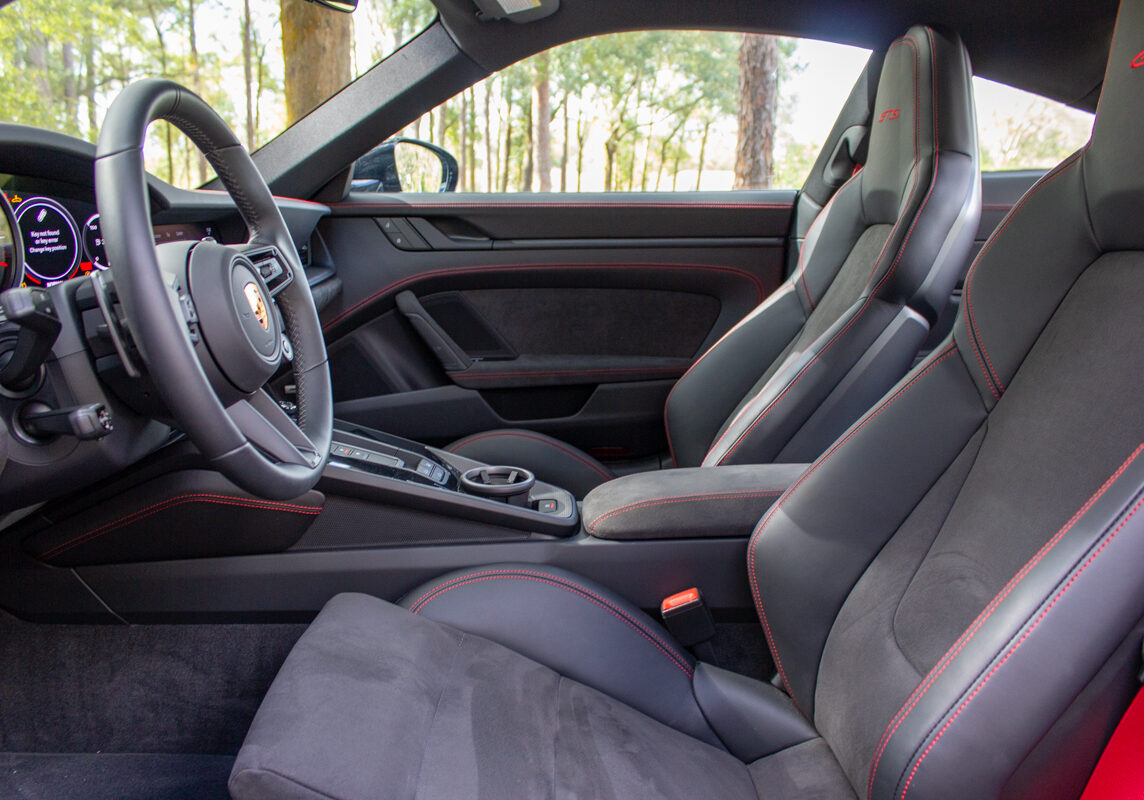 2022_Porsche_911_Carrera_GTS_20230102 - (195)comp Example of Automotive Photography. Car Photography and Videography for Bring-a-Trailer, Auto Hunter, Barn Finder, Auto Trader, and any car and automobile sales sites. Car Photo is of the driver's side interior of a fire engine red 2022 Porsche 911
