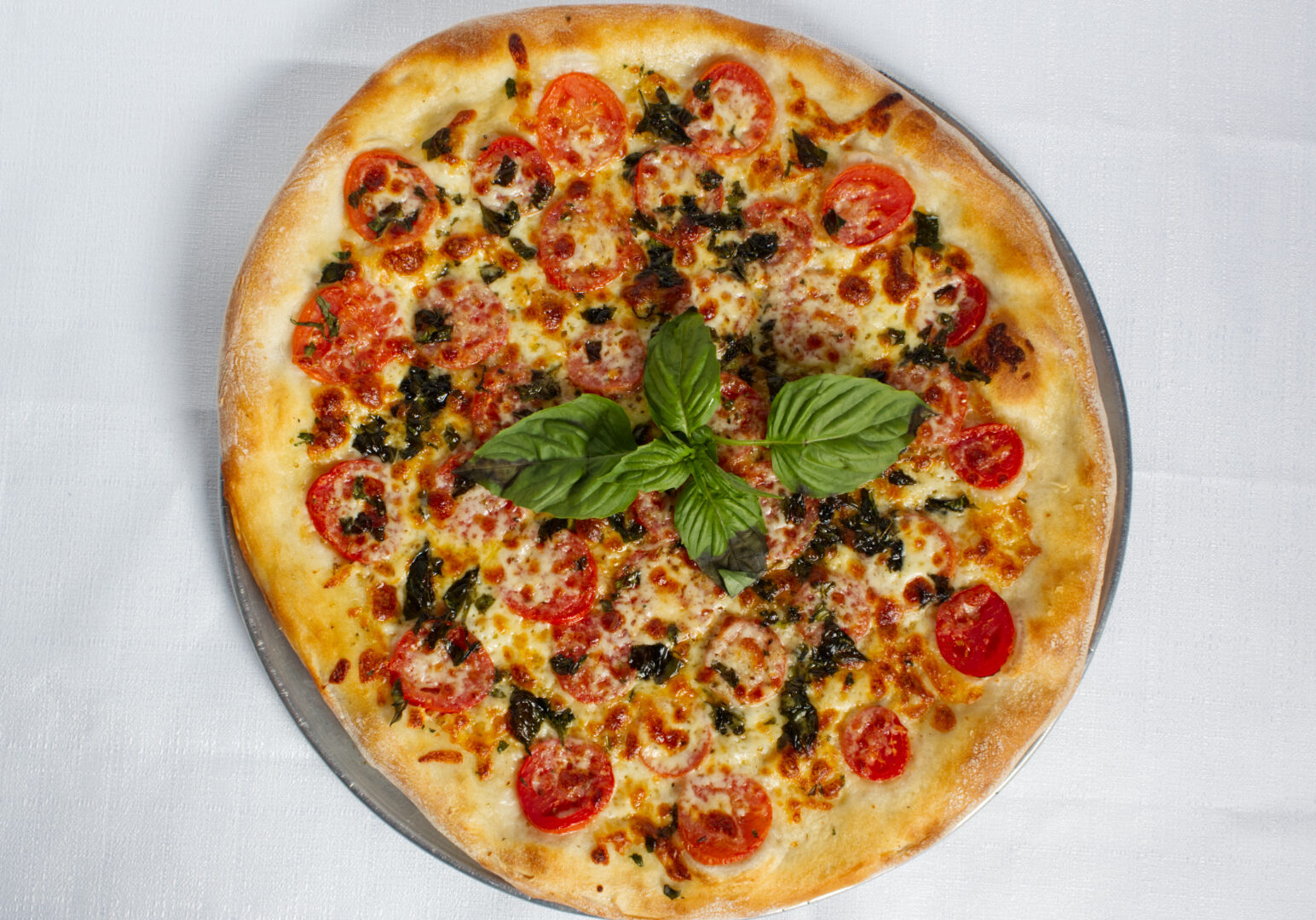 Image_01 Example of Food Photography for DoorDash, Uber Eats, Grub Hub, and any food delivery service app. Food Photo is of a margherita pizza on a white background.
