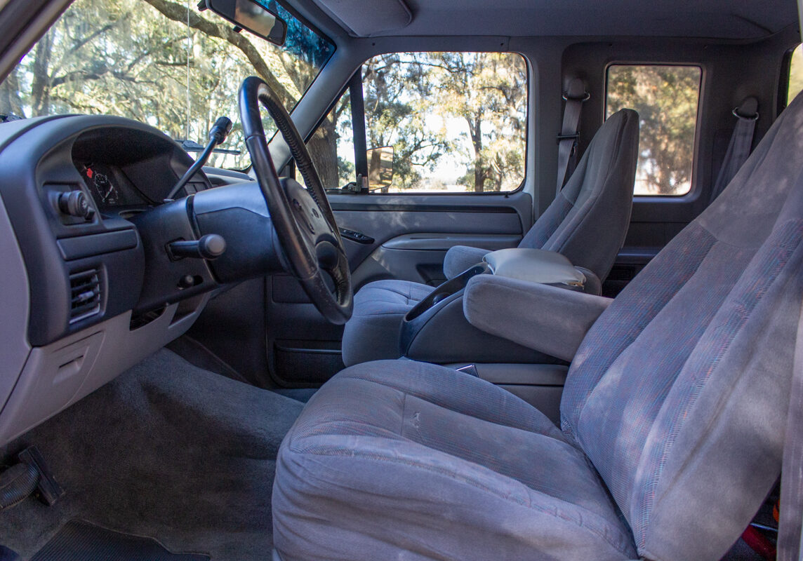 Ford_F250_20250207 - (154)comp Example of Automotive Photography. Car Photography and Videography for Bring-a-Trailer, Auto Hunter, Barn Finder, Auto Trader, and any car and automobile sales sites. Car Photo is of the interior of a white Ford F-250 from the driver's side of the vehicle.