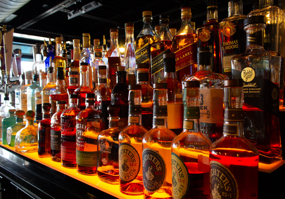 Interior_20220830 - 006comp Example of Food Photography for DoorDash, Uber Eats, Grub Hub, and any food delivery service app. Food Photo is of an alchol shelf in a bar portion of a restaraunt, showcasing the wide varity of beverages avaialable.