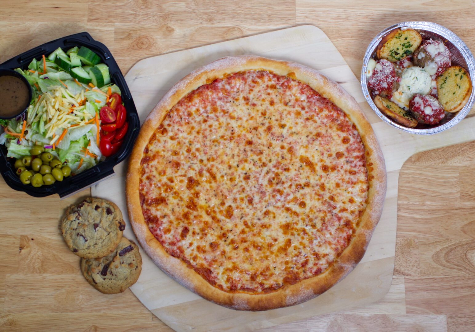 Image_07 Example of Food Photography for DoorDash, Uber Eats, Grub Hub, and any food delivery service app. Food Photo is of a pizza featured on a pizza paddle with ingredients on the pizza positioned around it in the photo.